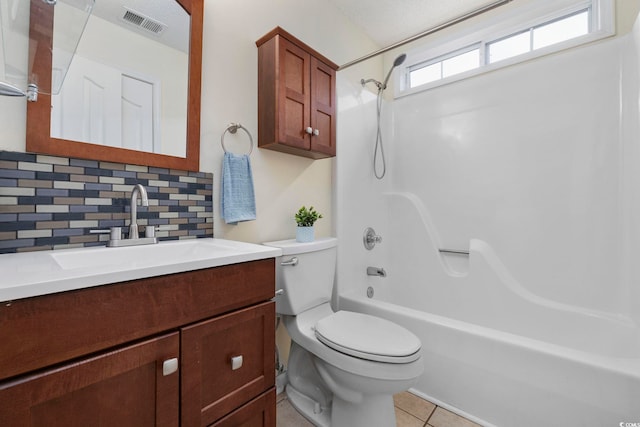 bathroom with visible vents, toilet, tile patterned floors,  shower combination, and backsplash