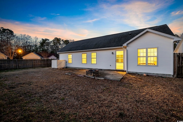 rear view of house featuring a patio and fence private yard