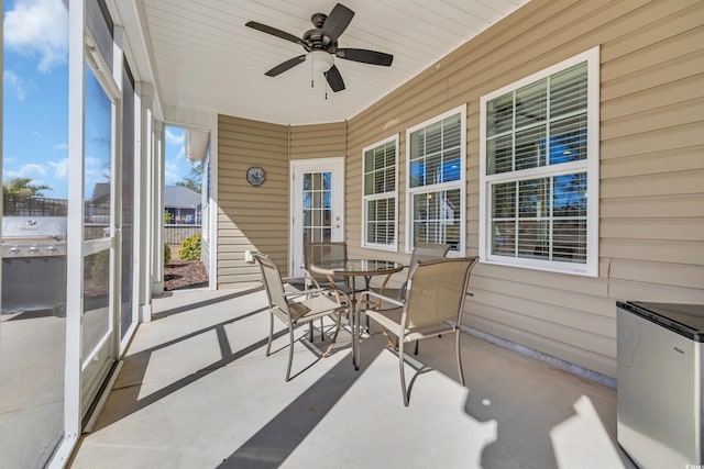 sunroom / solarium with ceiling fan