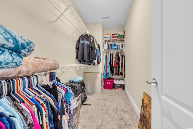 walk in closet featuring carpet and visible vents