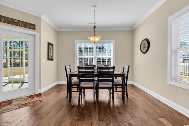 dining room featuring plenty of natural light and wood finished floors