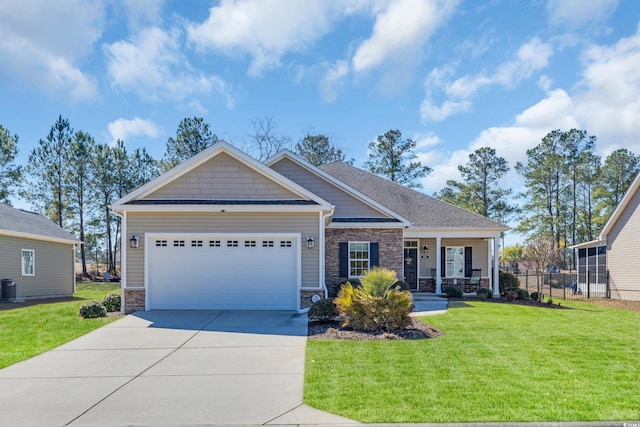 craftsman inspired home featuring central AC unit, concrete driveway, stone siding, an attached garage, and a front yard