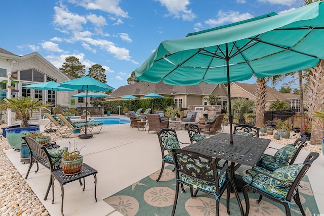3100 Lahinch Dr, Myrtle Beach, SC 29579 - view of patio / terrace featuring exterior kitchen, fence, a fenced in pool, and outdoor dining space
