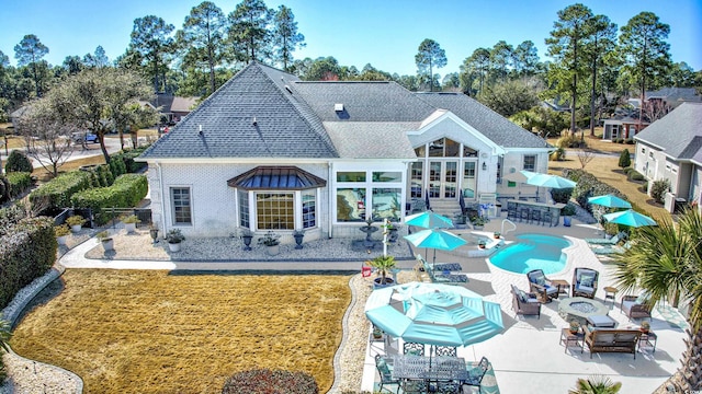 3100 Lahinch Dr, Myrtle Beach, SC 29579 - back of property featuring outdoor dining area, roof with shingles, a patio area, and an outdoor living space