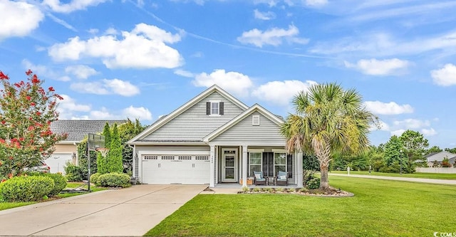 view of front of house featuring a porch, concrete driveway, and a front yard