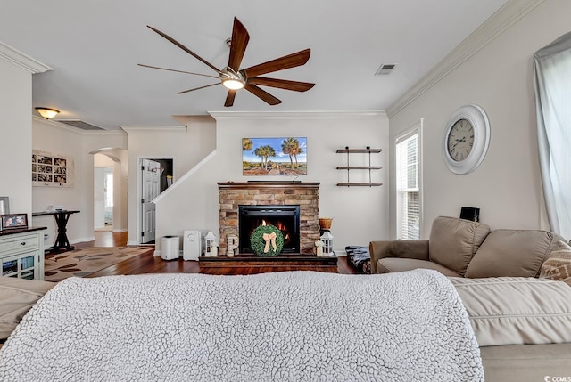 3600 White Wing Cir, Myrtle Beach, SC 29579 - living area with ceiling fan, arched walkways, ornamental molding, a fireplace, and wood finished floors