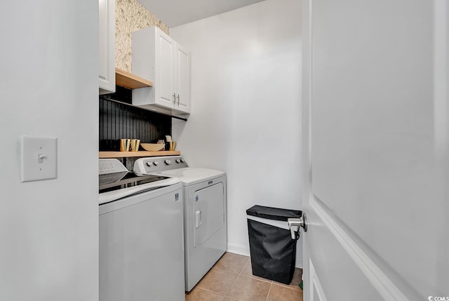 3600 White Wing Cir, Myrtle Beach, SC 29579 - laundry room featuring washer and clothes dryer, cabinet space, and light tile patterned flooring