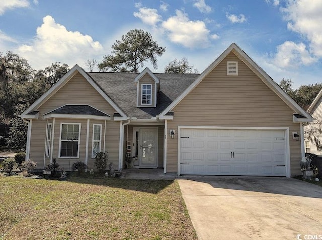 view of front of home with a garage, a front yard, and concrete driveway