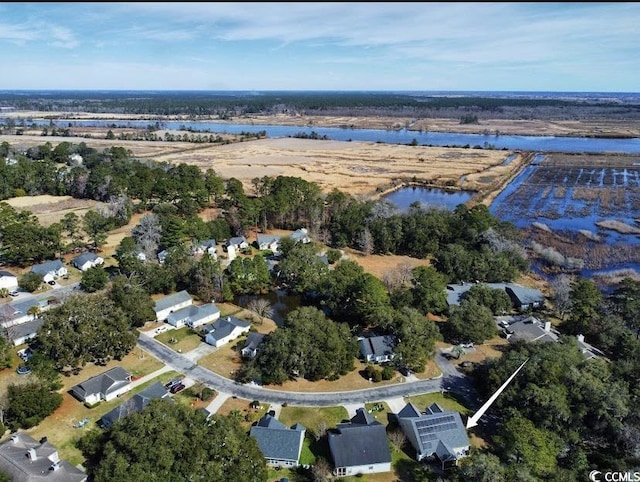 bird's eye view featuring a residential view and a water view