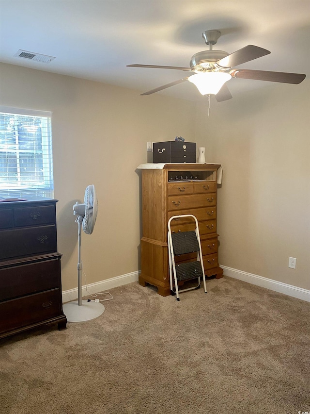 bedroom with carpet floors, visible vents, ceiling fan, and baseboards