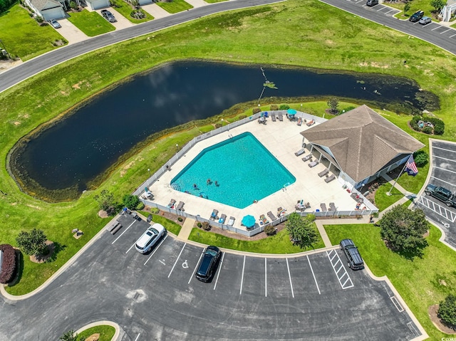 birds eye view of property with a water view