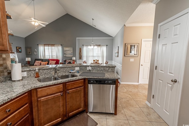 kitchen featuring light tile patterned floors, a peninsula, a sink, stainless steel dishwasher, and brown cabinets