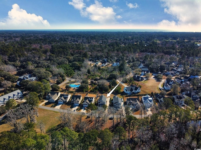 aerial view with a residential view and a wooded view