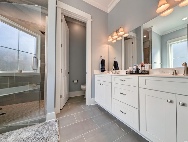 bathroom with toilet, a sink, ornamental molding, a shower stall, and double vanity