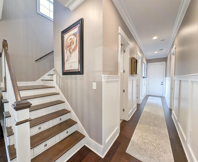 corridor featuring ornamental molding, recessed lighting, dark wood finished floors, and stairway