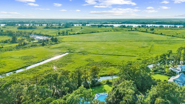 drone / aerial view with a rural view and a water view