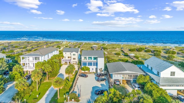 aerial view with a water view, a view of the beach, and a residential view