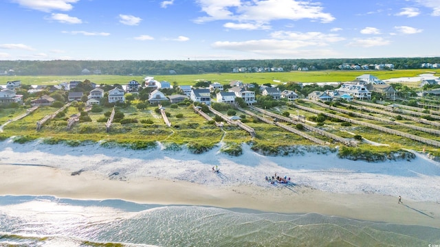 birds eye view of property with a water view, a residential view, and a view of the beach