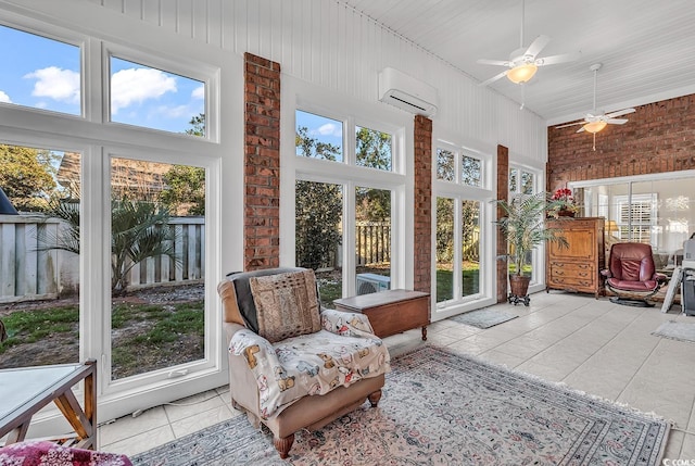 sunroom / solarium with ceiling fan, an AC wall unit, and plenty of natural light