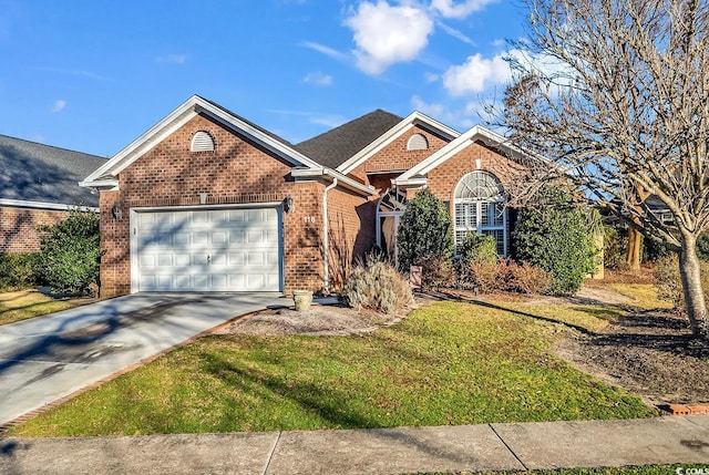 ranch-style house featuring a garage, driveway, brick siding, and a front yard