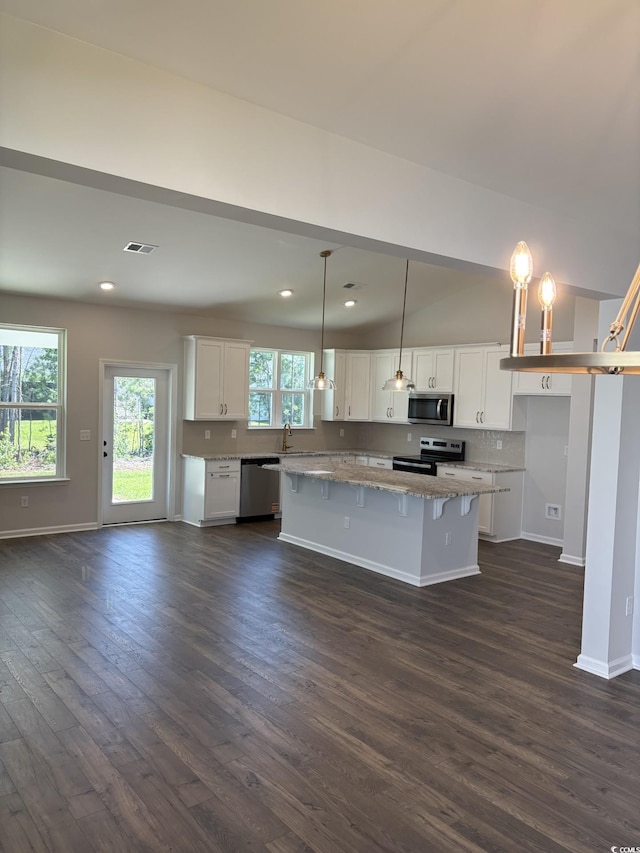 183 Glengrove Ln, Murrells Inlet, SC 29576 - kitchen with stainless steel appliances, a kitchen island, dark wood finished floors, white cabinets, and recessed lighting