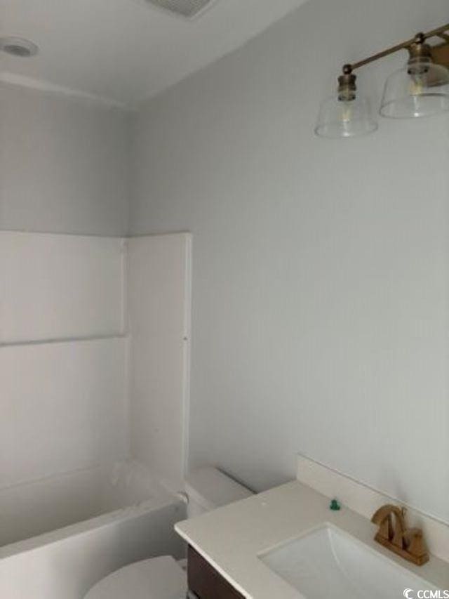 bathroom with toilet and vanity