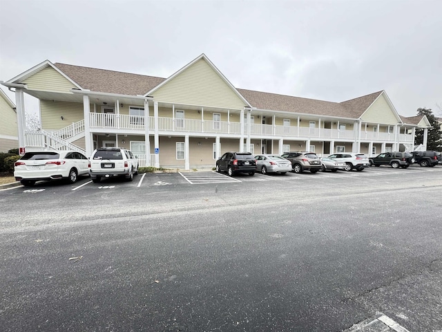 view of property featuring uncovered parking