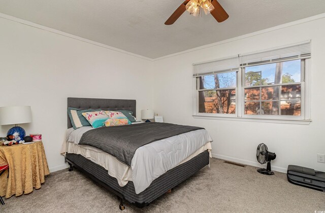 bedroom with light carpet, baseboards, visible vents, and ceiling fan