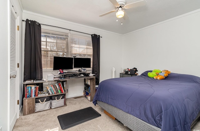 bedroom with carpet floors, crown molding, and ceiling fan