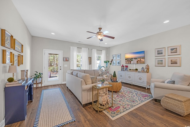 living area featuring wood finished floors, a ceiling fan, and recessed lighting