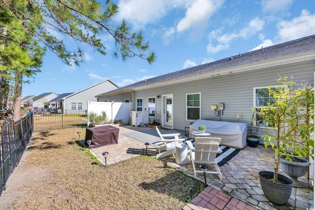 back of house featuring a patio and fence