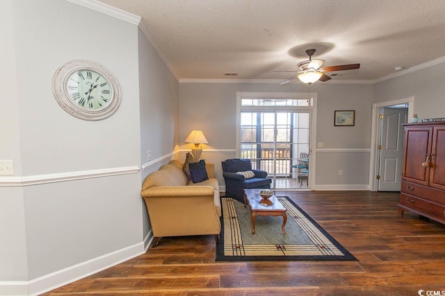 sitting room featuring crown molding, visible vents, a textured ceiling, wood finished floors, and baseboards