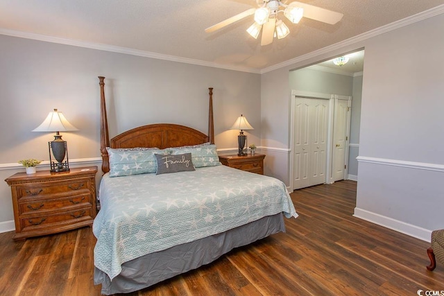 bedroom with baseboards, a closet, wood finished floors, and crown molding