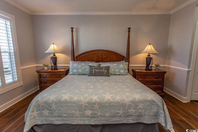 bedroom featuring multiple windows, baseboards, and wood finished floors