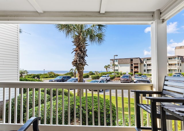 balcony featuring a water view