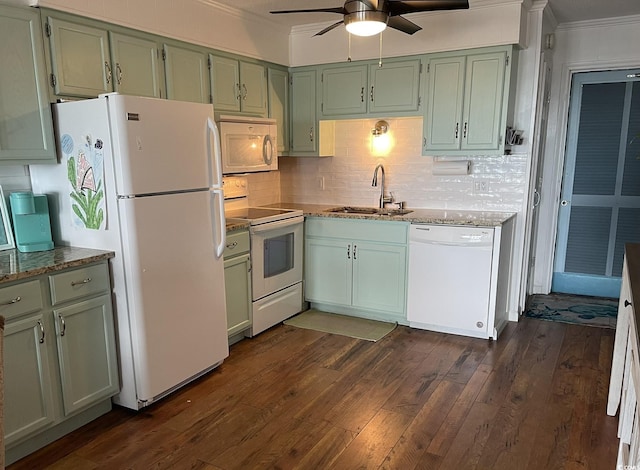 kitchen with dark wood finished floors, ornamental molding, a sink, light stone countertops, and white appliances