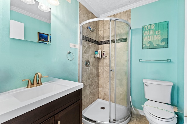 full bath featuring a textured ceiling, toilet, vanity, a stall shower, and crown molding