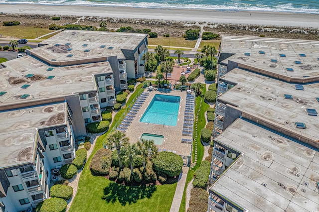 bird's eye view featuring a water view and a view of the beach