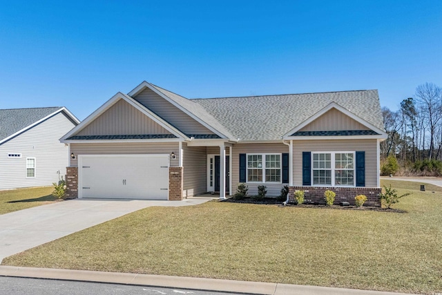 craftsman inspired home with an attached garage, driveway, brick siding, and a front yard