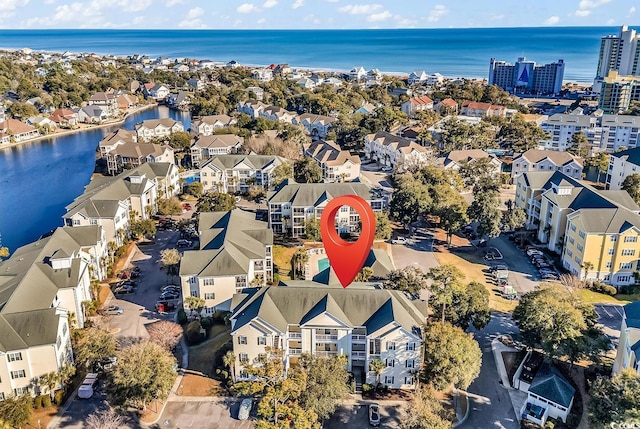 birds eye view of property featuring a water view and a residential view