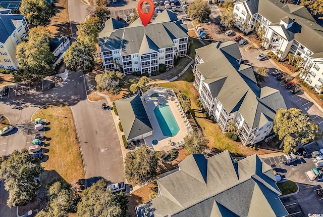 birds eye view of property with a residential view