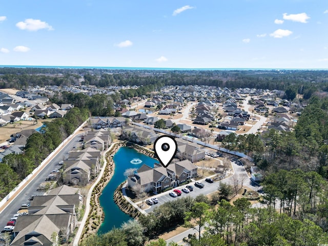 bird's eye view with a water view and a residential view