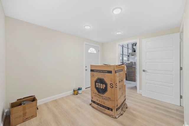 interior space with light wood-style floors and baseboards