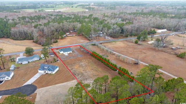 birds eye view of property with a rural view