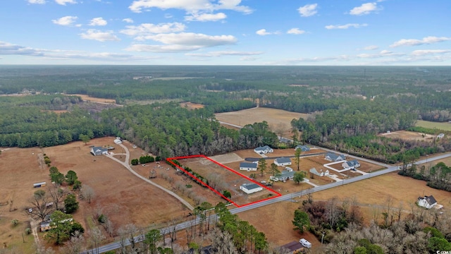 aerial view featuring a view of trees