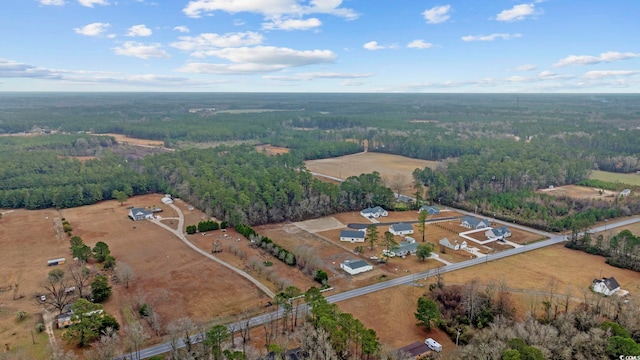 aerial view with a wooded view