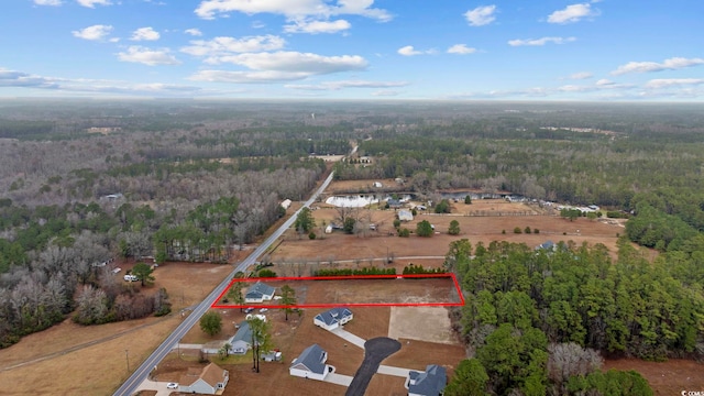 aerial view featuring a view of trees