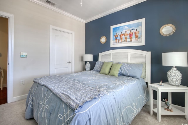 bedroom with baseboards, ornamental molding, visible vents, and light colored carpet