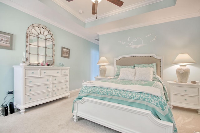 bedroom featuring ornamental molding, a raised ceiling, a ceiling fan, and light colored carpet