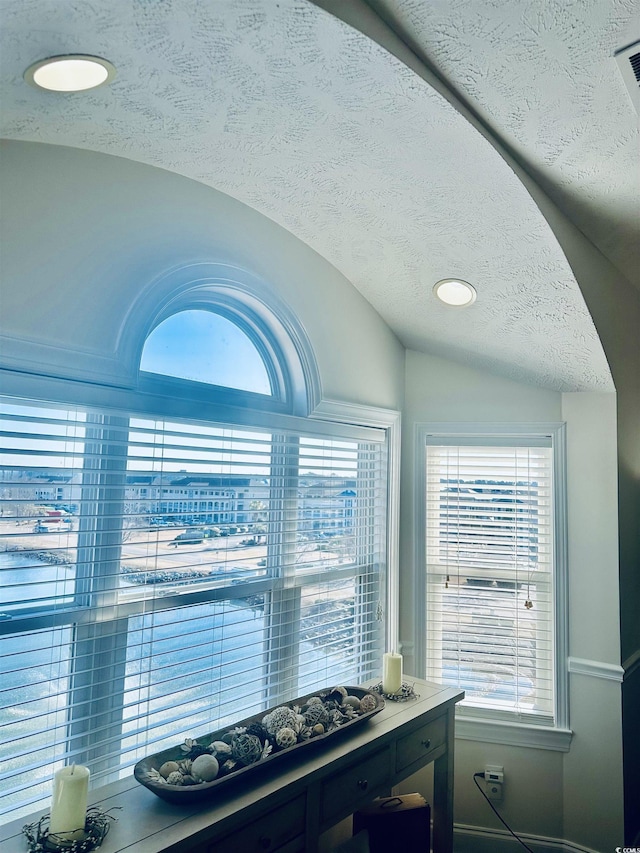 room details with a textured ceiling and recessed lighting